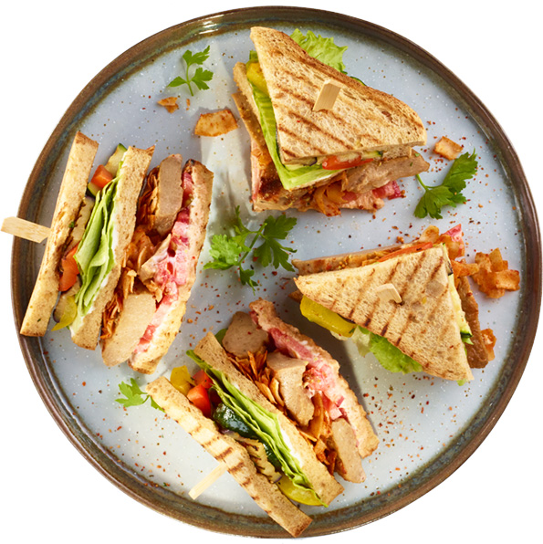 Club Sandwich with Plant-Based Chicken Strips, vegan bacon and paprika crisps
